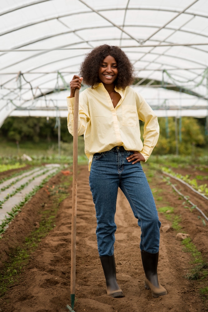 African farmers working together in a crop field